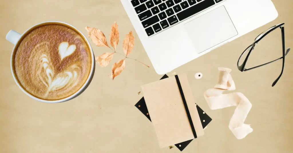 Mental health tips for freelancers workspace with laptop and coffee