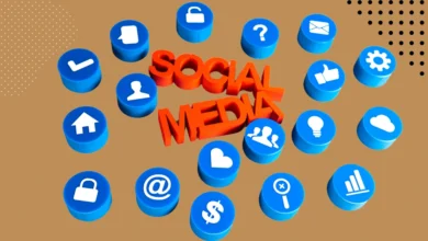 3D illustration of social media icons in blue with a bold red 'SOCIAL MEDIA' text in the center on a brown background.