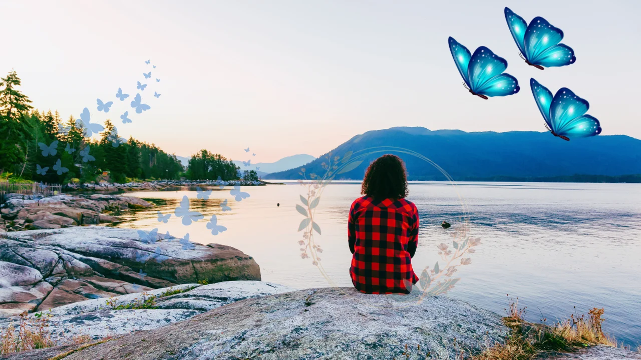Peaceful woman sitting by a calm lake in nature symbolizing mental clarity and overthinking recovery