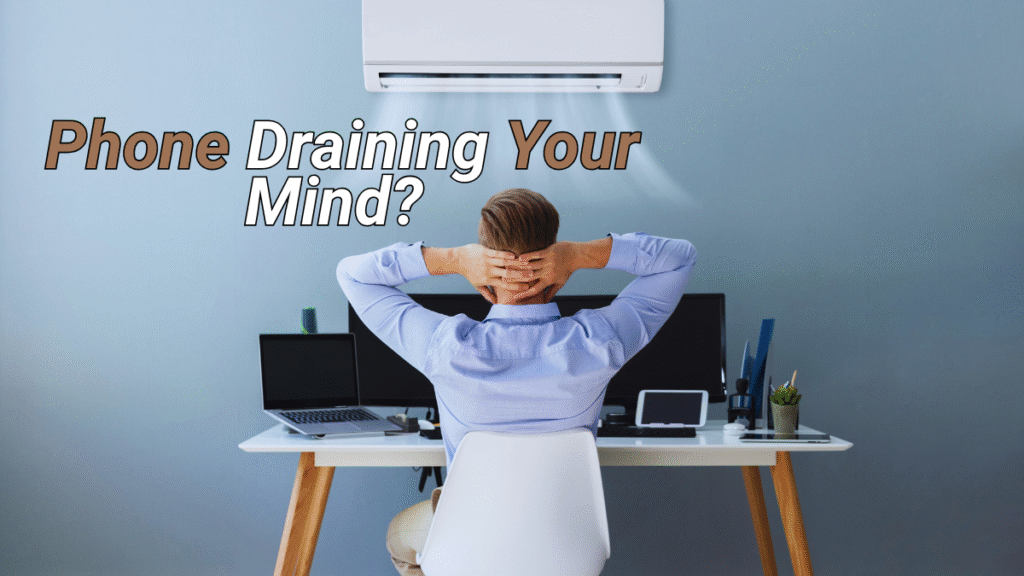 Man overwhelmed at desk with text "Phone Draining Your Mind