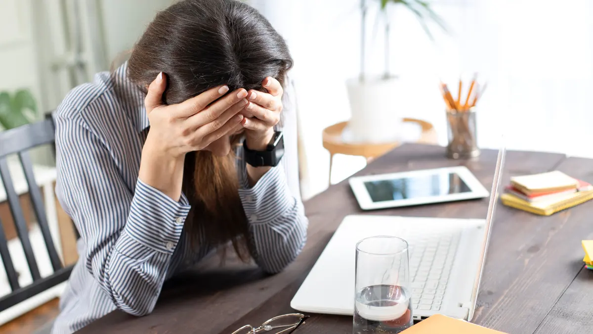 Tired woman with mental fatigue at work